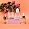 เครื่องสำอางที่ว่างเปล่า 1oz 2oz 30ml 60ml Skincare น้ำหอมเซรั่มน้ำมันหอมระเหยผม Dropper แก้วขวด