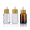 Logo personnalis&eacute; 100 ml d'emballage cosm&eacute;tique en verre mat 15 ml 20 ml 30 ml 50 ml bouteilles d'huile essentielle de visage de cheveux en verre rond avec bouchon compte-gouttes en bambou
