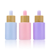 Logo personnalis&eacute; 100 ml d'emballage cosm&eacute;tique en verre mat 15 ml 20 ml 30 ml 50 ml bouteilles d'huile essentielle de visage de cheveux en verre rond avec bouchon compte-gouttes en bambou