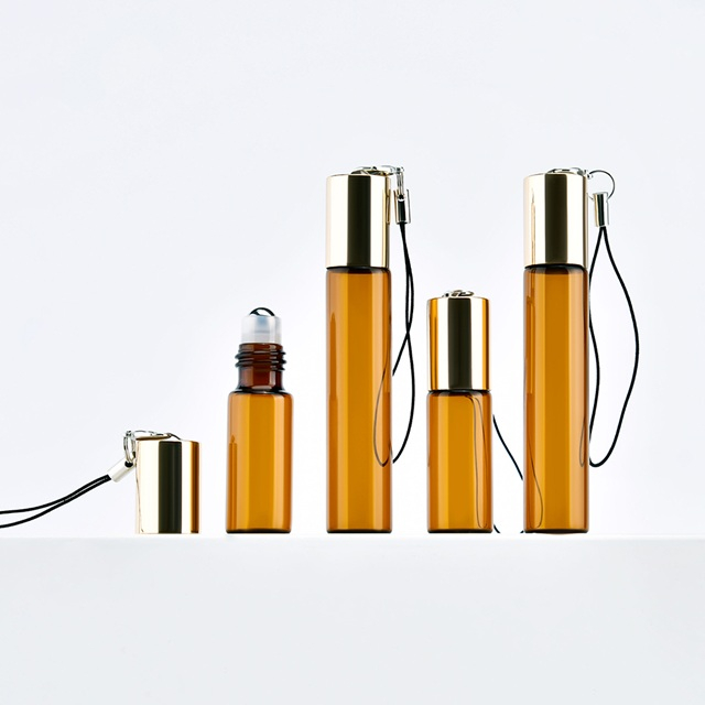 5 ml bernsteinfarbene Glas-Tintenrollerflasche mit individuellem Logo und Schl&uuml;sselanh&auml;nger, Reisegr&ouml;&szlig;e, Parf&uuml;m-Probeflasche f&uuml;r &auml;therische &Ouml;le f&uuml;r OEM/ODM